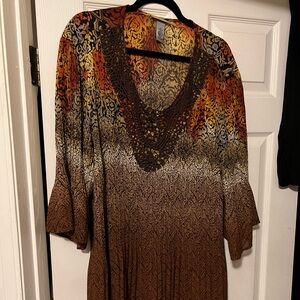 Catherine’s orange brown and cream dress shirt. It’s size 22/24w wore max 2xs